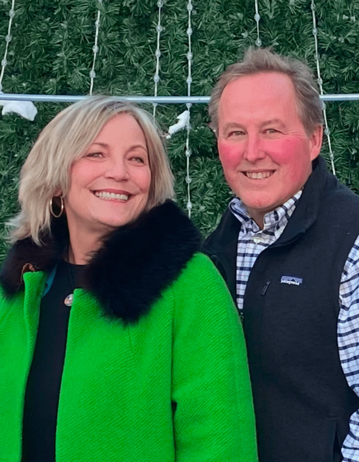 Two People Smiling To The Camera
